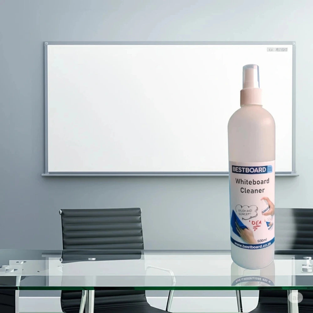 Office meeting room with a whiteboard on the wall and a bottle of BestBoard Whiteboard Cleaner placed on a glass table