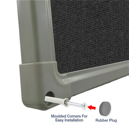 Exploded view of a charcoal carpet pin board corner showing the moulded corner piece and rubber plug for easy installation