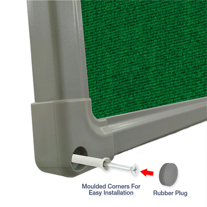 Exploded view of a green carpet pin board corner showing the moulded corner piece and rubber plug for easy installation