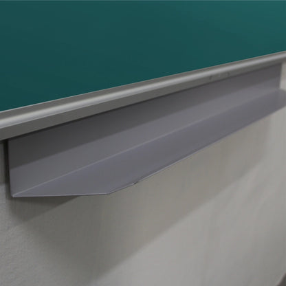 Close-up of a gray metal chalkboard lip or penrail mounted beneath a green chalkboard on a white wall.
