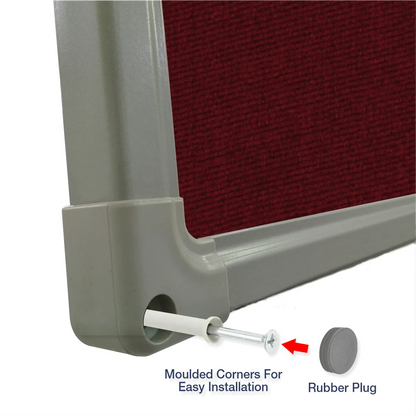 Exploded view of a maroon carpet pin board corner showing the moulded corner piece and rubber plug for easy installation